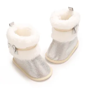 Detailed view of silver glitter baby girl winter boots featuring soft white faux fur trim
