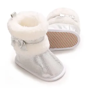 Silver metallic infant baby girl boots featuring white faux fur and anti-slip sole details
