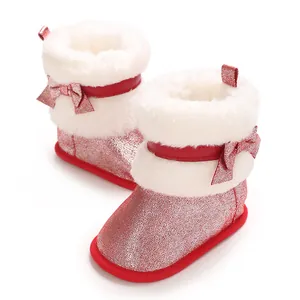 Sparkly red baby girl winter boots featuring soft white faux fur trim and cute bow details