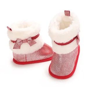 Detailed view of red glitter baby winter boots with soft faux fur lining