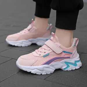 Stylish pink breathable mesh sneakers for girls with durable white chunky rubber soles.
