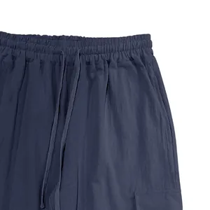 Detailed view of the adjustable drawstring waistband on men's cotton linen cargo pants.