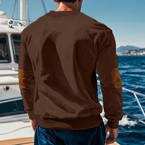 Detailed back view of men's brown corduroy sweatshirt with elbow patches on a yacht