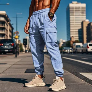 Men's light blue cargo joggers in an urban street setting with large side pockets.