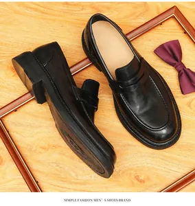 Detailed top view of black horse leather loafers featuring premium handmade stitching detail