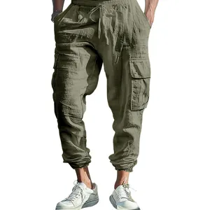 Detail view of men's cotton linen cargo pants featuring drawstring and pockets