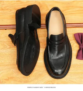 Overhead detail of handmade vintage horsehide loafers with Goodyear welted sole texture.