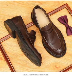 Detailed view of vintage horsehide leather loafers featuring fine stitching and textures.