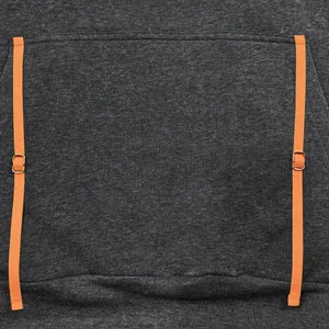 Close-up of a grey fleece hoodie featuring vibrant orange strap details on the front pocket.