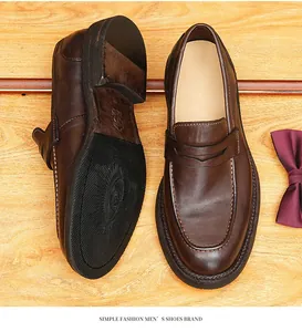 Close-up of vintage brown horse leather loafers showing upper design and sole texture.