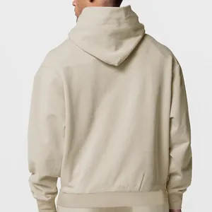 Back view of a premium men's solid cream hooded sweatshirt with fleece lining for winter
