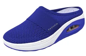 Side view of blue breathable mesh mules with air cushion and white platform sole.