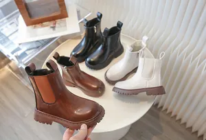 Detail showing children's retro British style Martin boots in three classic colors