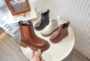 Detailed view showcasing children's retro British style Chelsea boots in three classic colors.