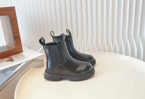 Classic black children's Chelsea boots with slip-on design and thick rubber sole
