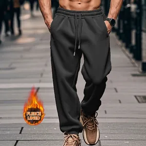 Detailed view of men's dark grey fleece-lined leisure joggers for outdoor autumn wear