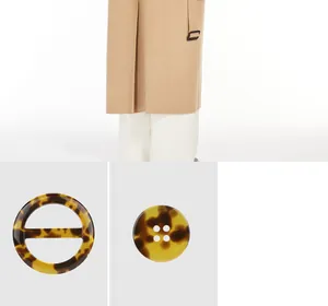 Close-up detail of high-end resin buttons and buckle with classic tortoiseshell pattern