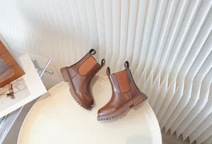 High-quality brown children's British style Chelsea boots featuring a chunky lug sole