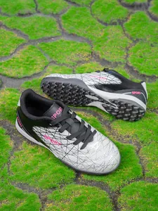 Durable turf soccer shoes for boys with stylish mesh pattern and pink accents