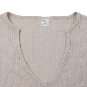 Close-up of ribbed V-neckline and fabric texture on men's knit T-shirt