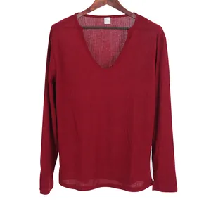 Detailed view of men's burgundy V-neck ribbed knit long sleeve t-shirt on a hanger
