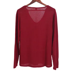 Detailed fabric texture of a red V-neck long-sleeve thin knit sweater for casual men.