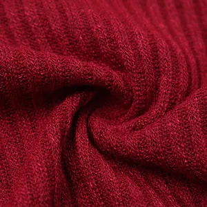 Close-up macro view showing the soft red knitted fabric texture of a men's sweater