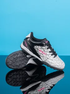 Professional boys' turf soccer shoes showing durable stud sole and gradient design