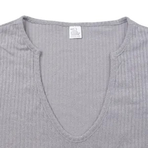 Close-up of gray ribbed knit V-neck T-shirt showing detailed fabric and size tag