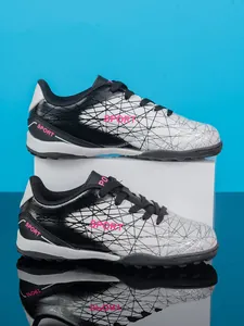 Boys turf soccer shoes with black and white gradient and pink SPORT text