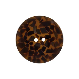 Professional studio shot of a round tortoiseshell resin button with two holes for apparel