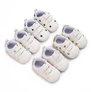 Selection of infant anti-slip sneakers featuring star and heart patterns and velcro straps