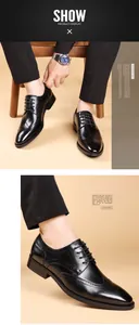 Detailweergave van zwarte Brogue Oxford schoenen met elegante wingtip snijpatronen.