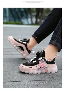 Pink and black girls sneakers featuring rotary buckle closure and breathable mesh upper