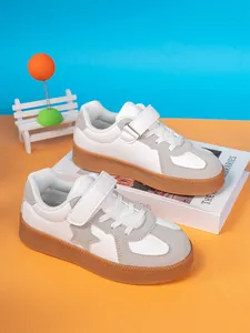 Stylish boys white and grey casual board sneakers with star pattern decoration and gum sole.