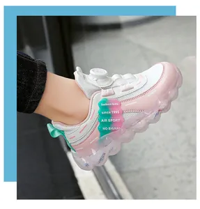Detail of girls pink mesh sneakers featuring a convenient rotating buckle closure.