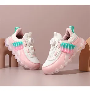 Close-up of pink girls' mesh sneakers featuring a convenient rotary dial lacing system.