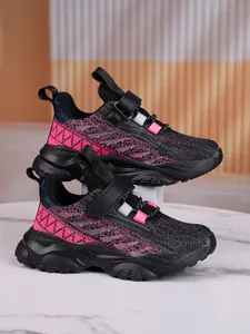 Detail view of kids breathable mesh sports shoes with pink and black knit