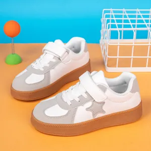 Casual children's white and grey leather sneakers with velcro strap and star detail