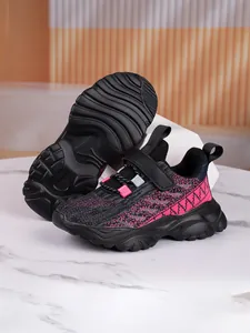 Detailed view of kids' breathable mesh sports shoes showing side profile and non-slip sole