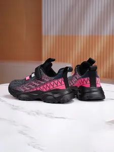 Back view of breathable mesh kids sneakers in black and pink with durable thick soles