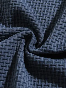 Macro view of navy blue textured elastic fabric for men's sports polo shirt detail