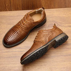 Close-up of men's brown business shoes featuring a unique scaly texture and classic lace-up style.