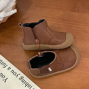 Brown leather Martin boots for toddlers, soft sole design with side zipper for easy wear.