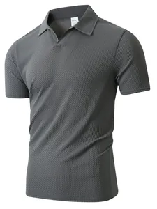 Close-up of dark grey textured stretch fabric on men's short-sleeved polo shirt
