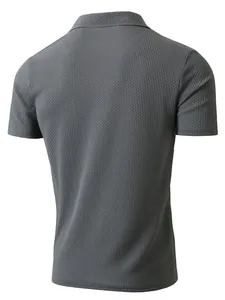 Back view of a grey men's short sleeve polo shirt featuring a distinct waffle texture.
