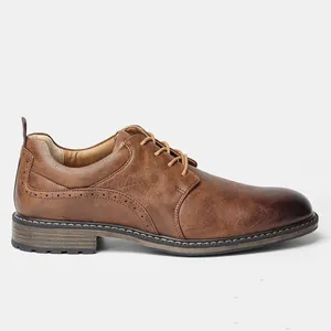 Detailed side view of brown textured leather dress shoe with elegant brogue patterns