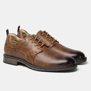 Macro detail of brown men's formal business shoes with elegant brogue wingtip stitching
