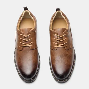 Detail view of brown men's business casual leather shoes with lace-up design and stitching