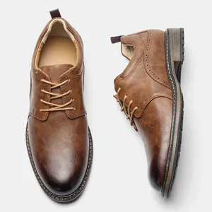 Brown men's business leather shoes with brogue detailing and lace-up design
